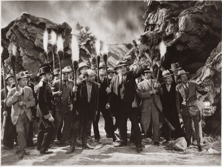 The torch-bearing mob, a staple of horror films of the era. 