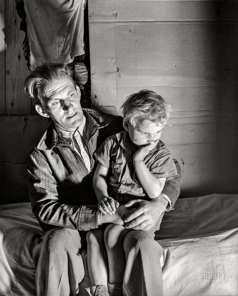 1939 ~ Butler County, Missouri, Evicted Sharecropper and Son in Migrant Camp